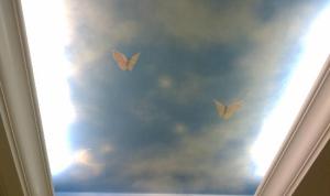 Hand-painted ceilings above bathroom vanities—each one was differeng